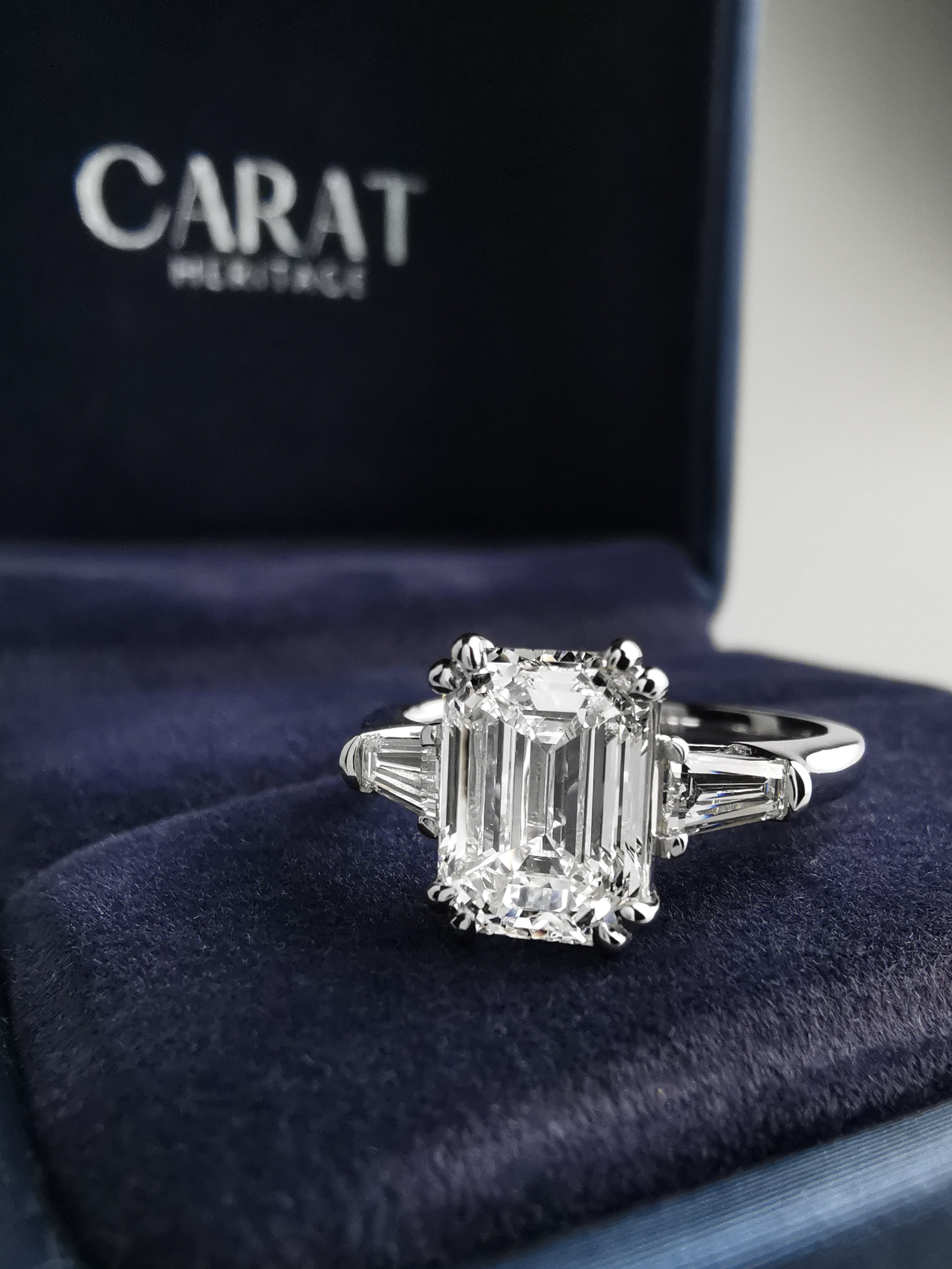 Emerald diamond ring with tapered baguettes