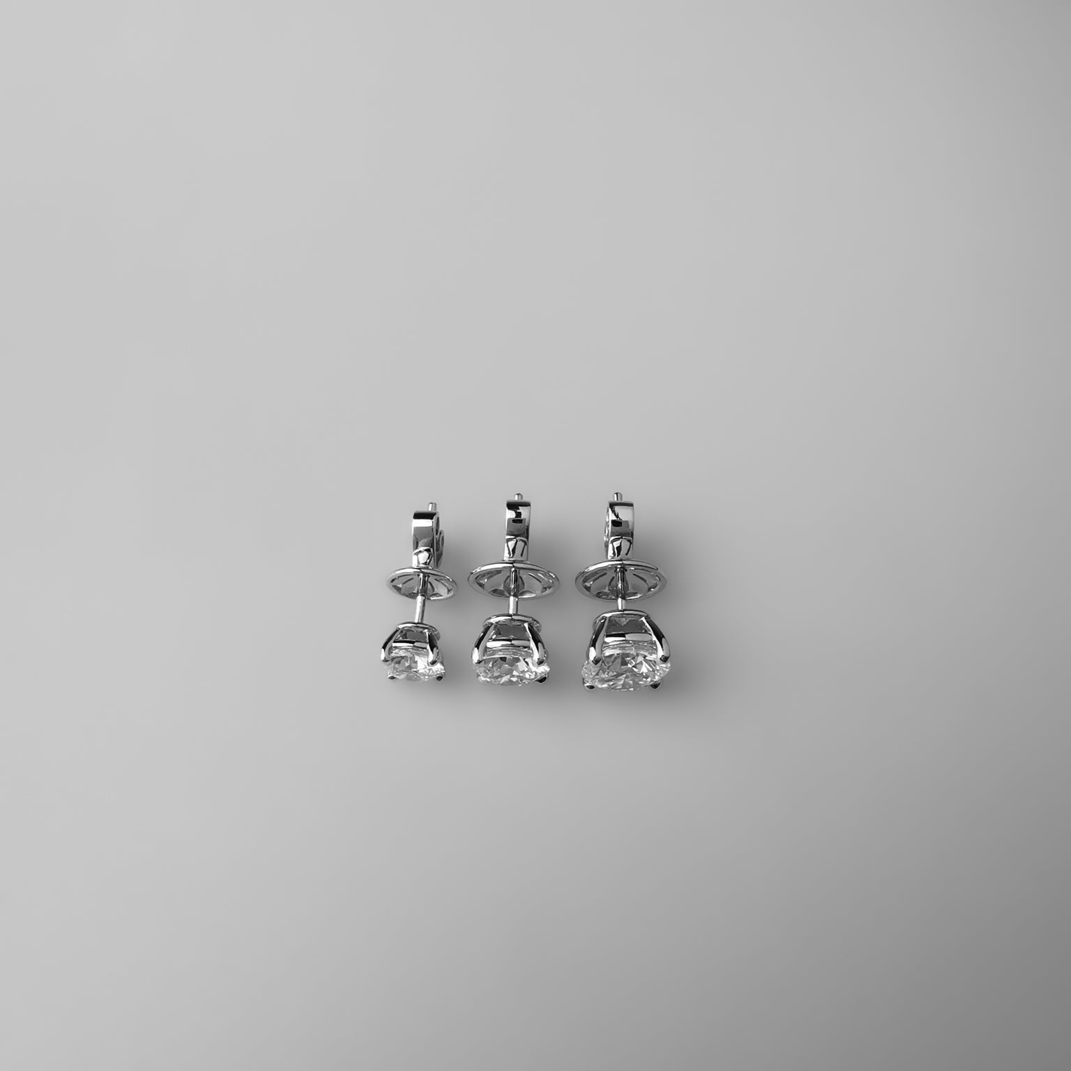 Round solitaire studs in different sizes top view