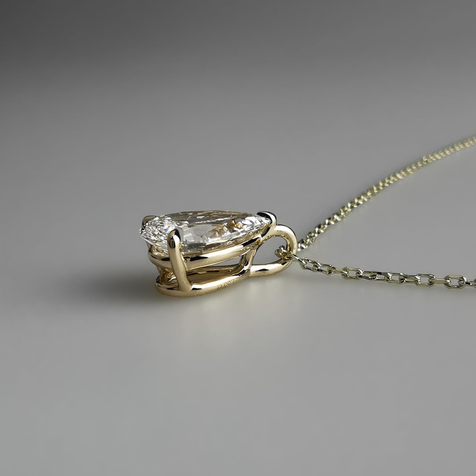 Yellow Gold Pear Pendant Necklace with bail on side view