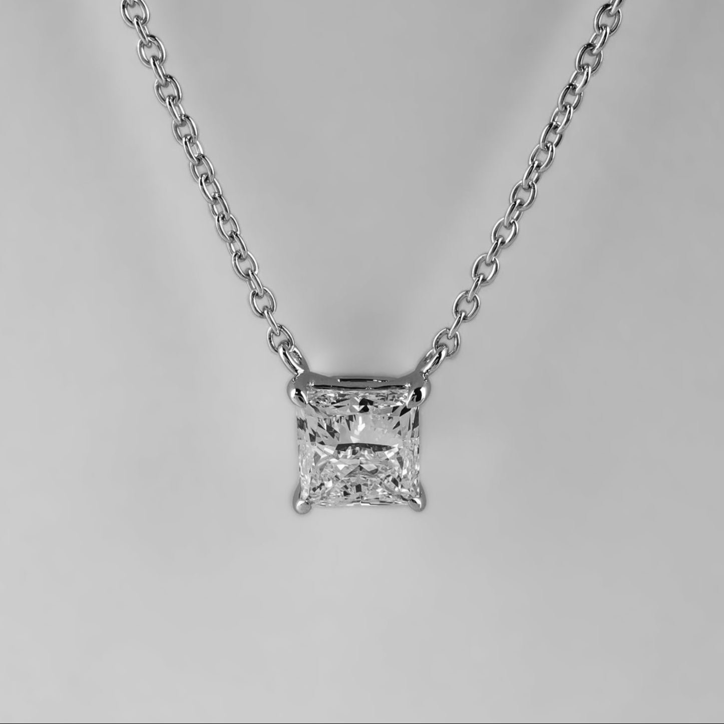 Princess Cut Diamond necklace on a light gray background