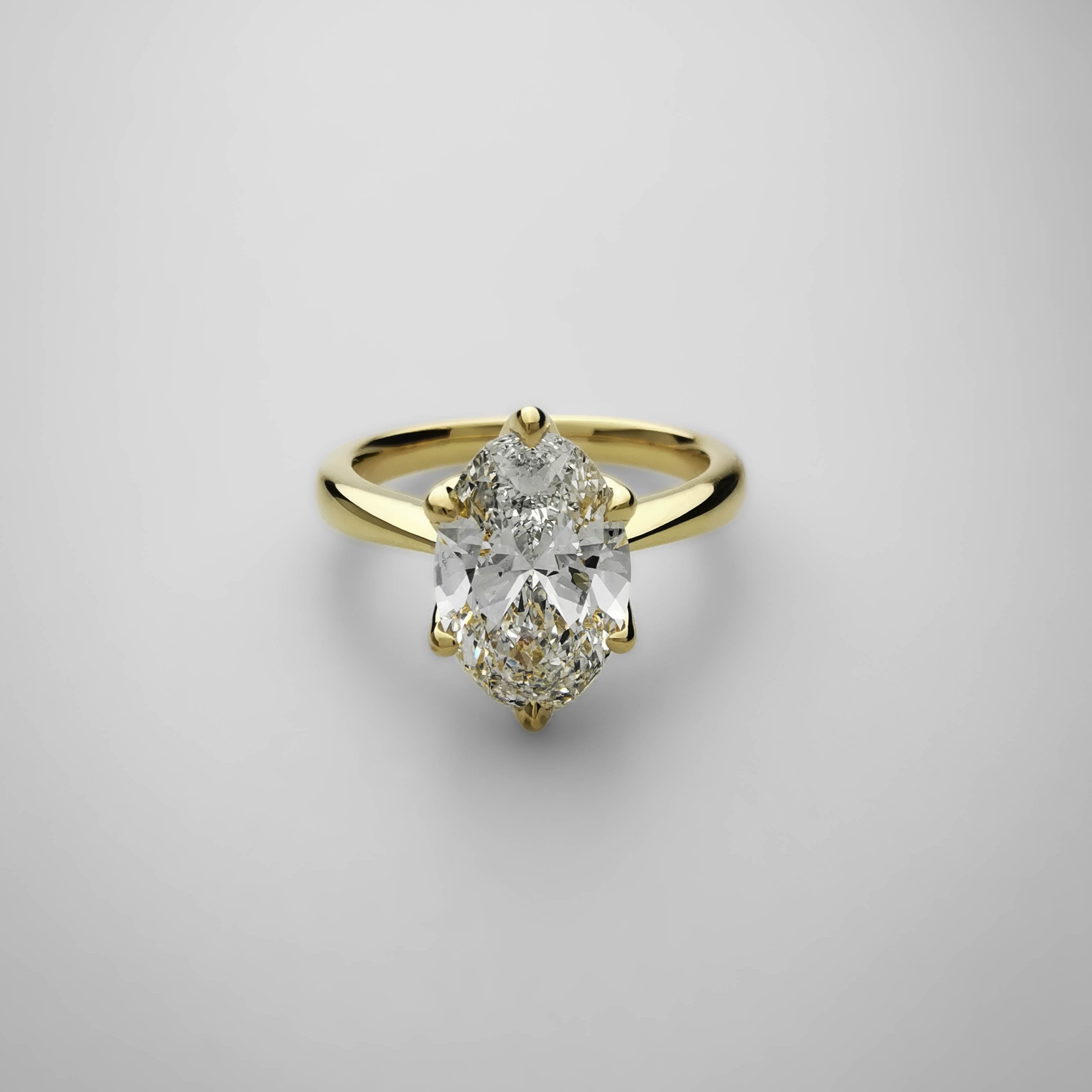 2 carat oval tulip prong setting yellow gold ring