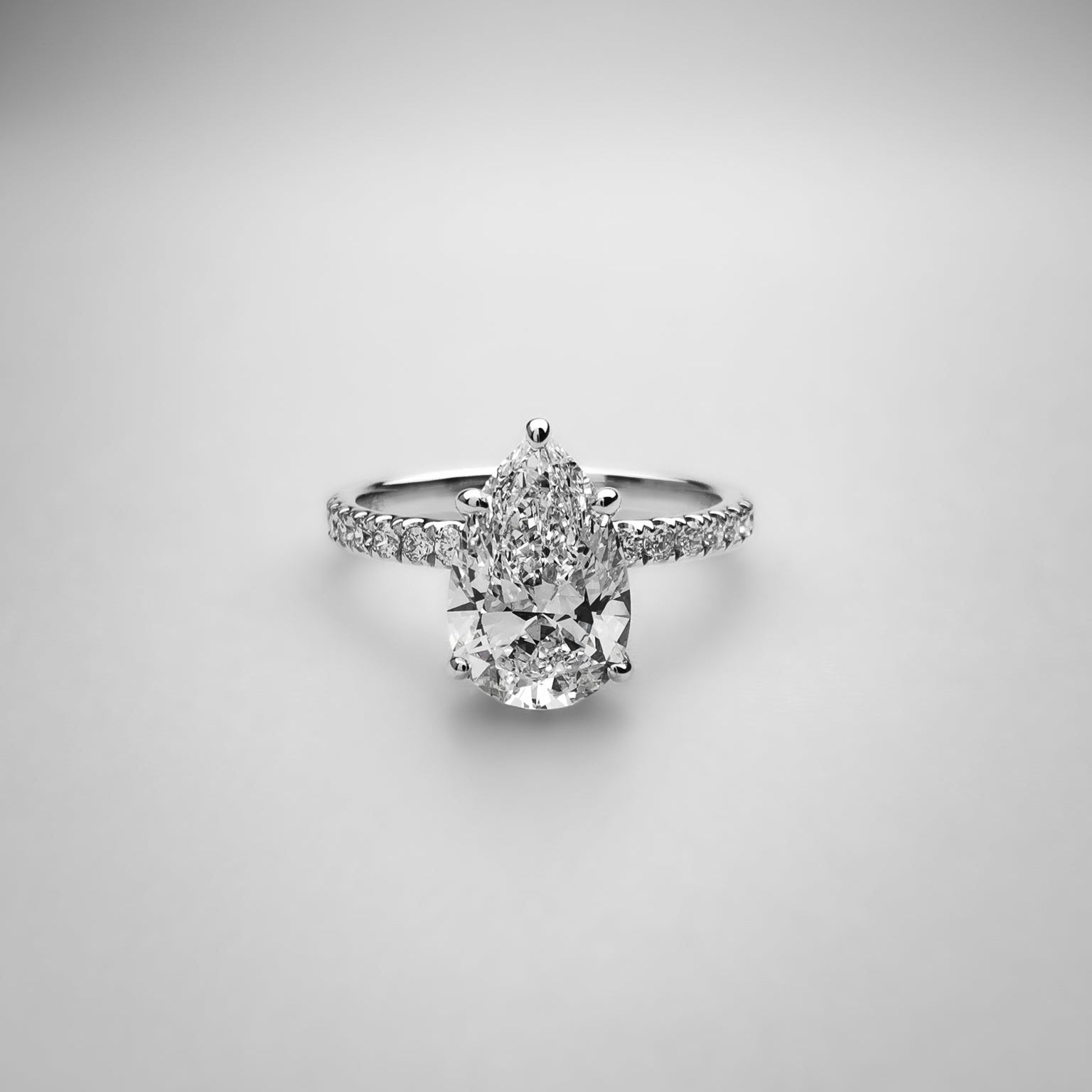 Pear on Melee Diamond Ring
