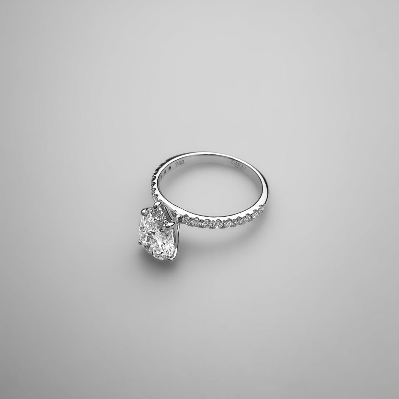 Pear on Melee Diamond Ring