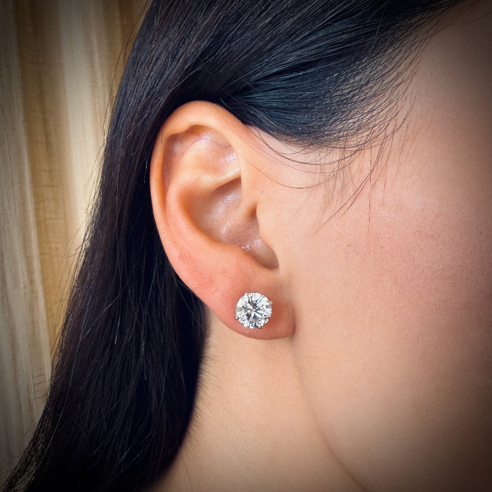diamond ear studs 2 carat on ear lobe