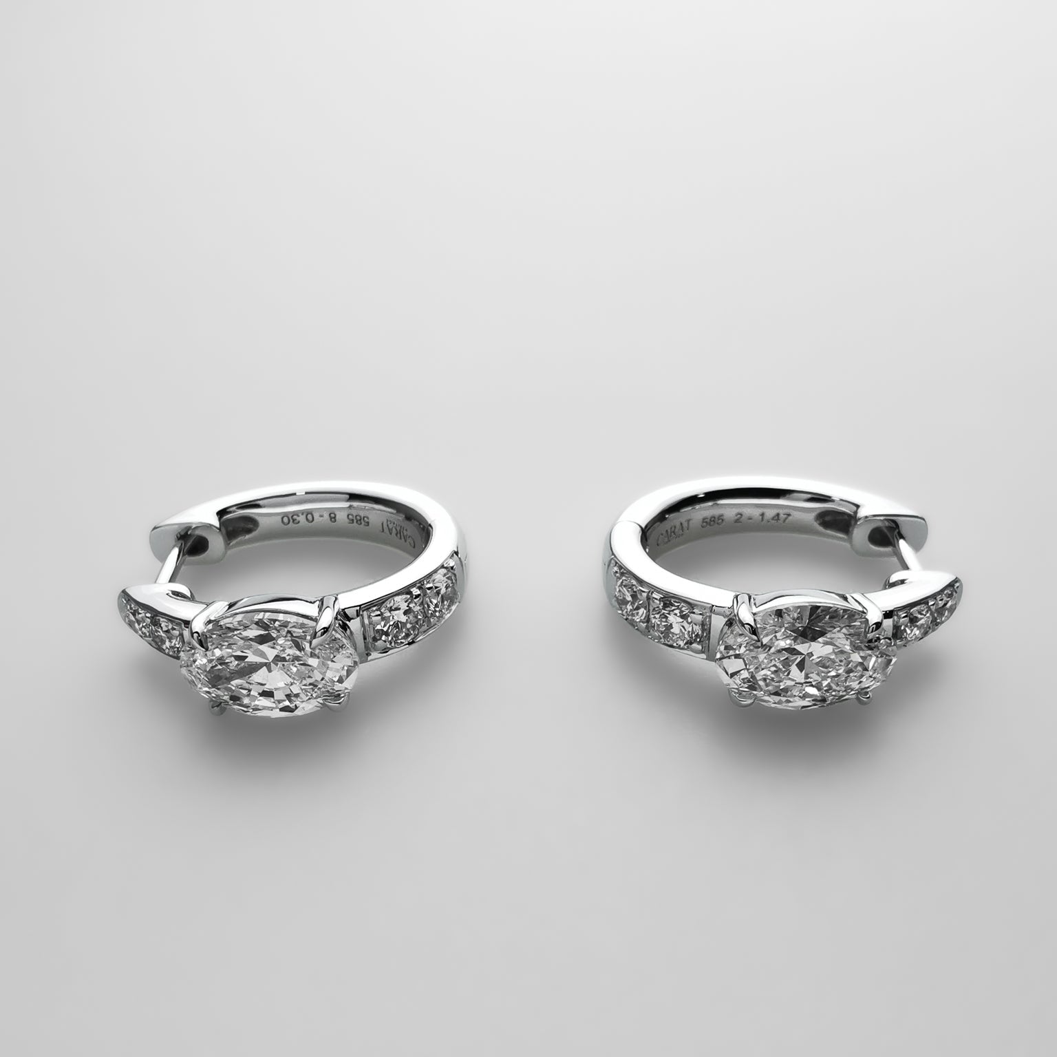 Oval diamond huggies earrings