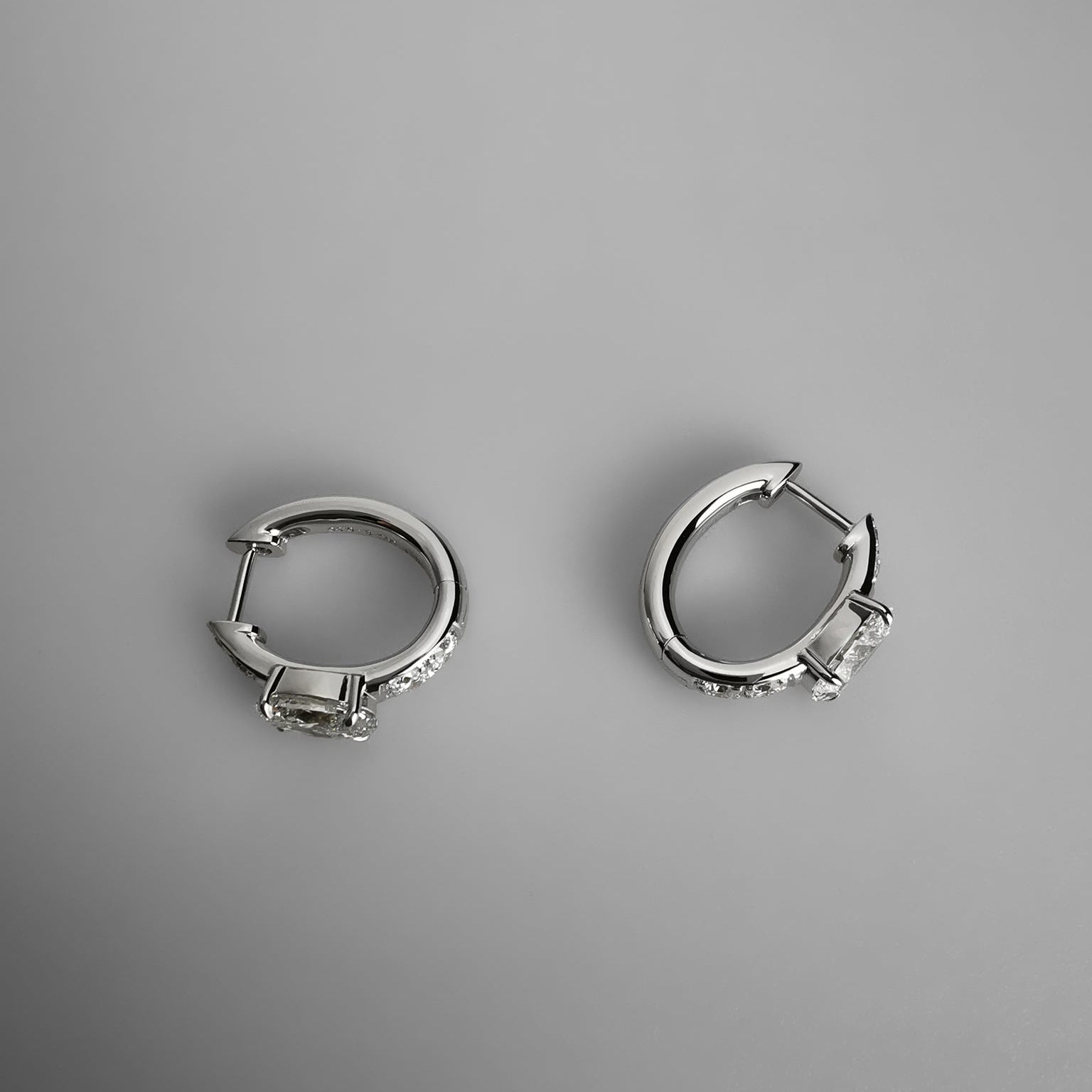 Oval diamond huggies earrings side