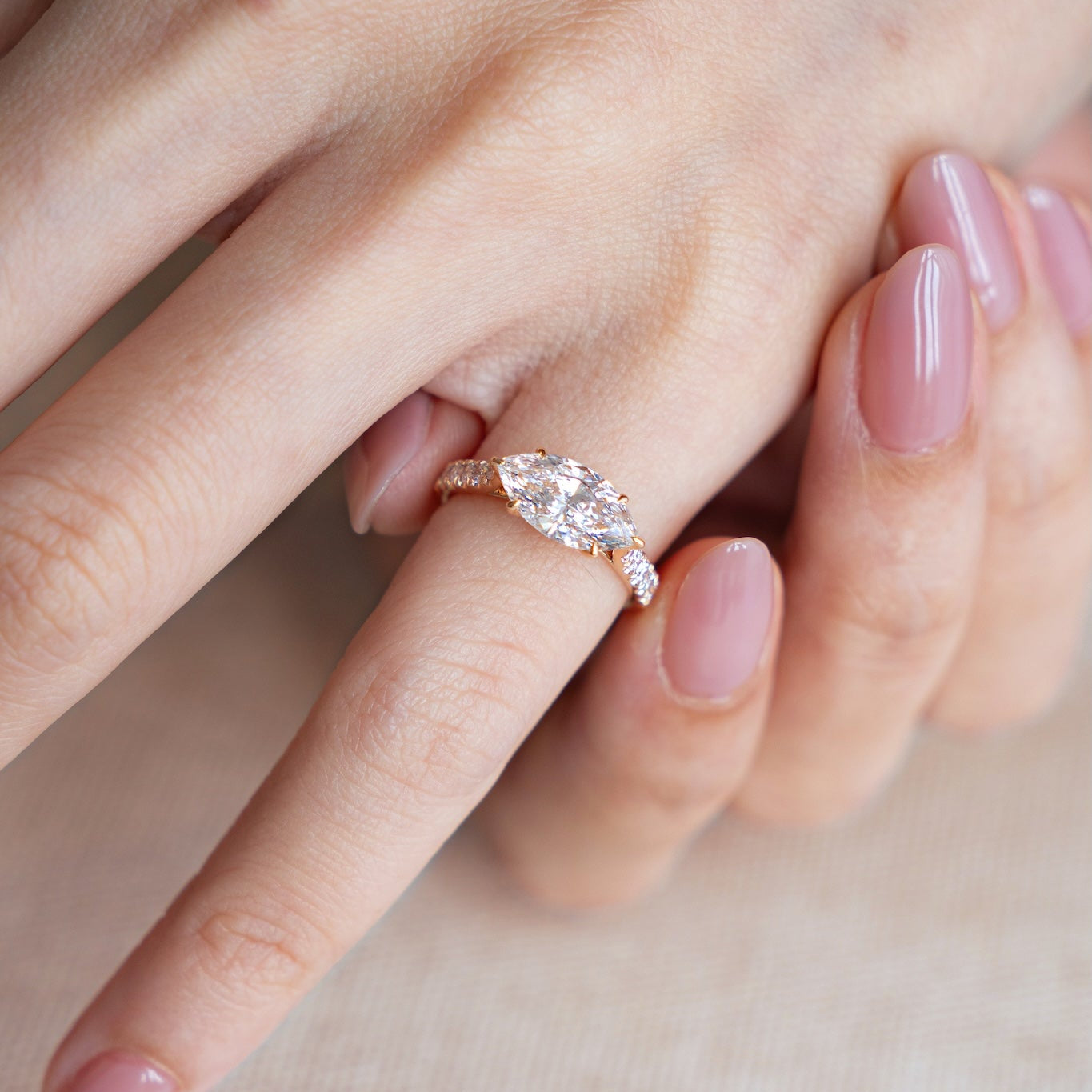 pinky diamond ring on finger