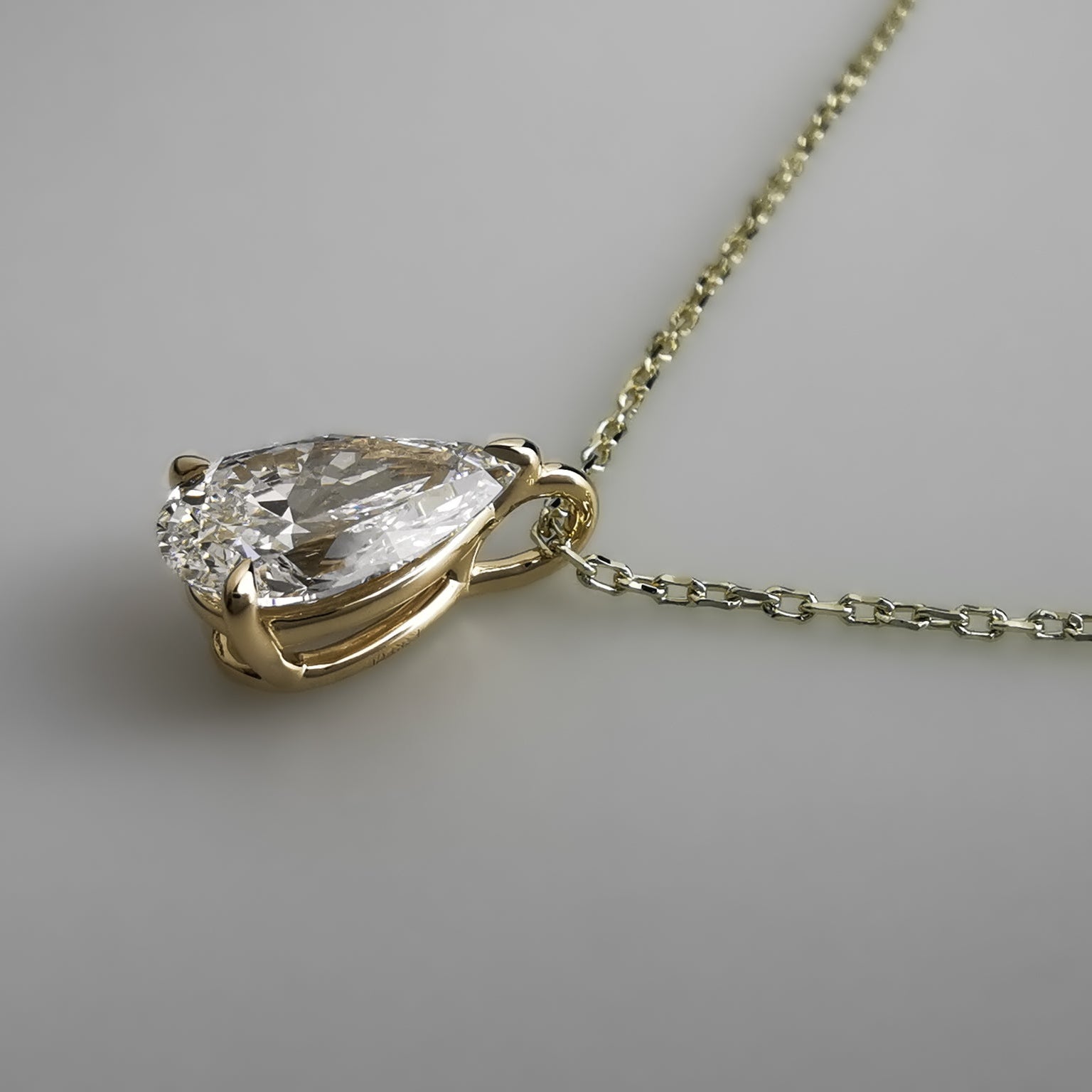 Yellow Gold Pear Pendant Necklace side view bail