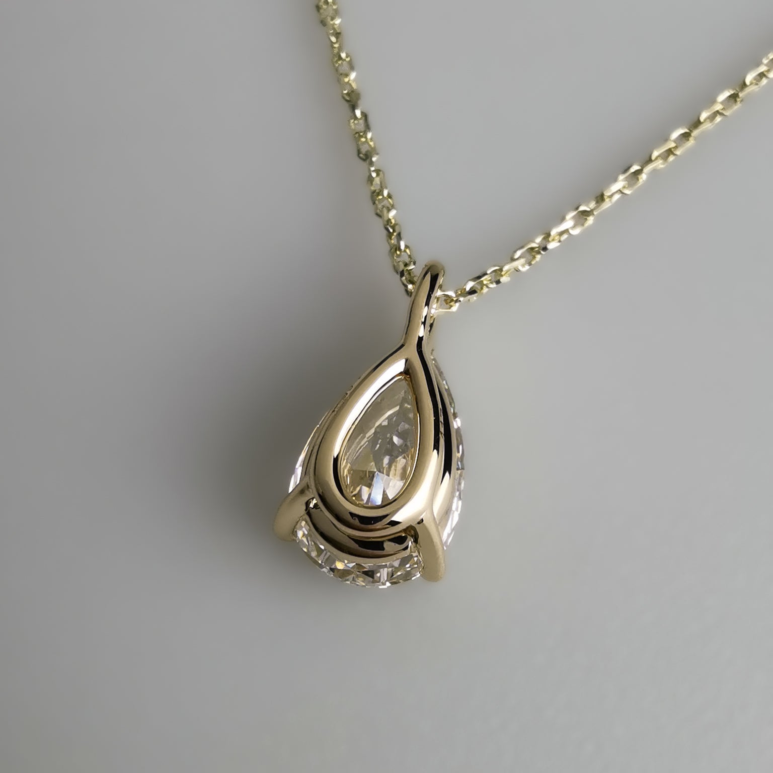 back of Yellow Gold Pear Pendant Necklace with open backing