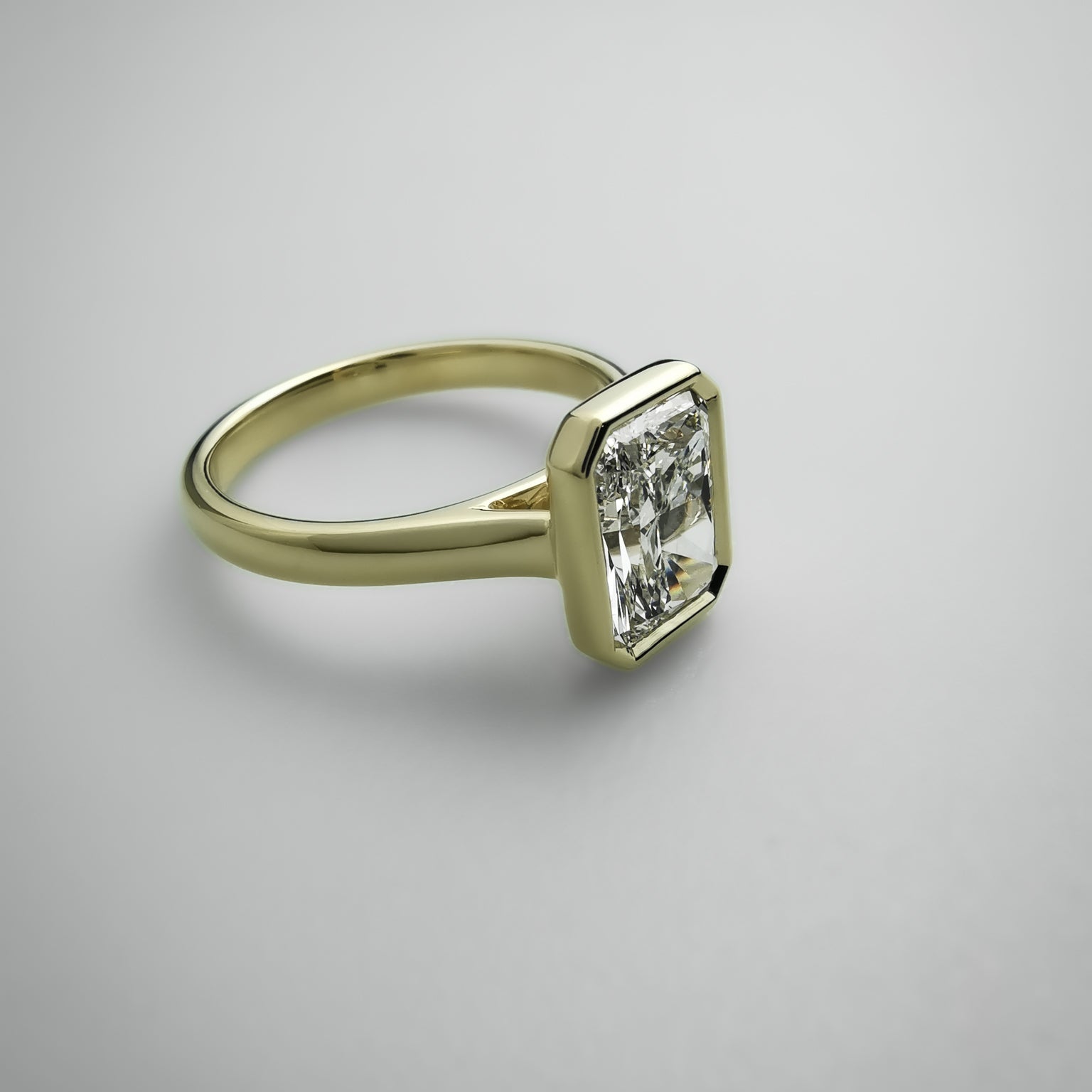 Radiant cut yellow gold ring