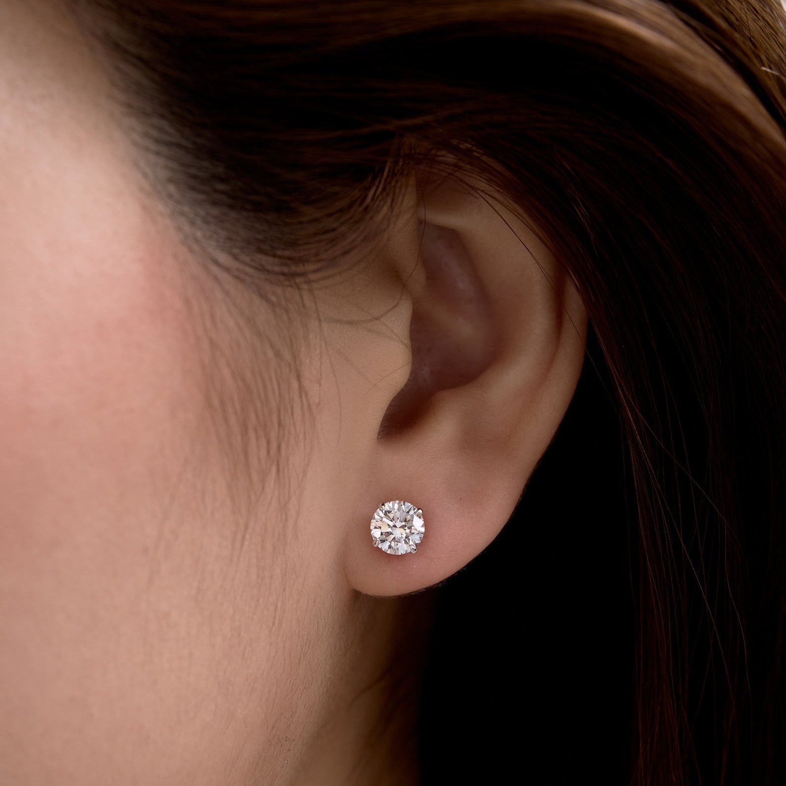 1 carat diamond stud on ear