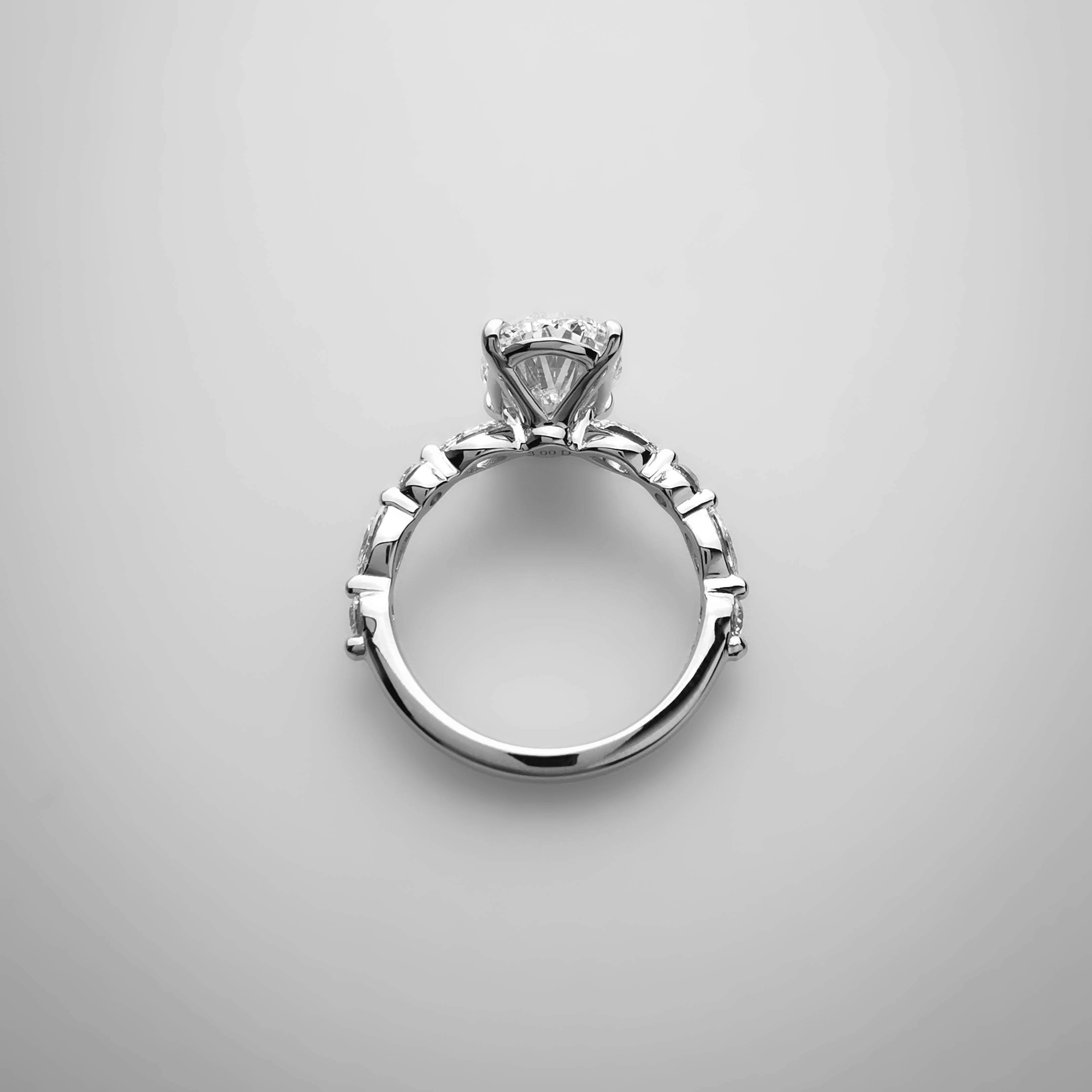3ct Oval diamond ring with alternating Marquise and Round side diamonds top view