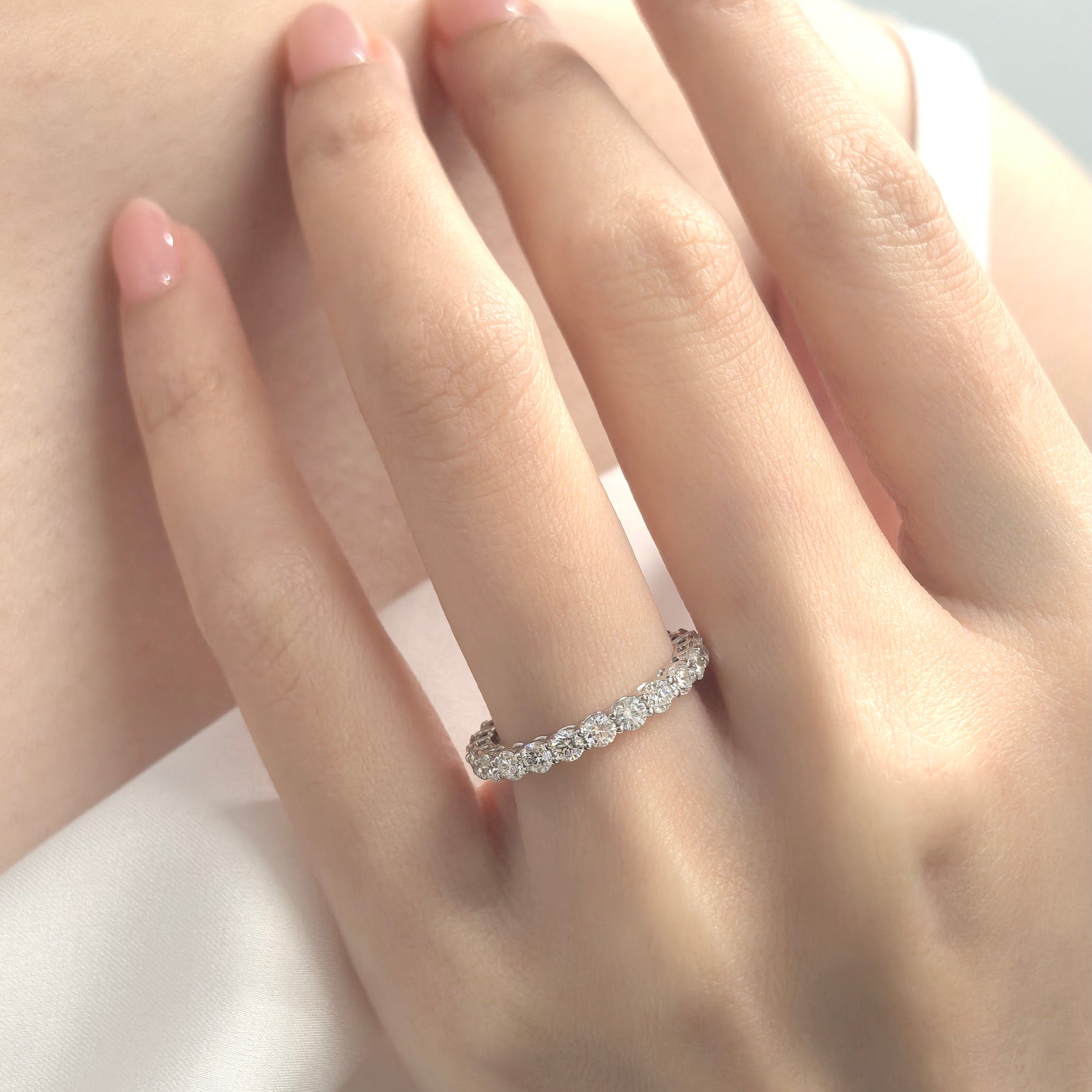 Eternity diamond band on hand
