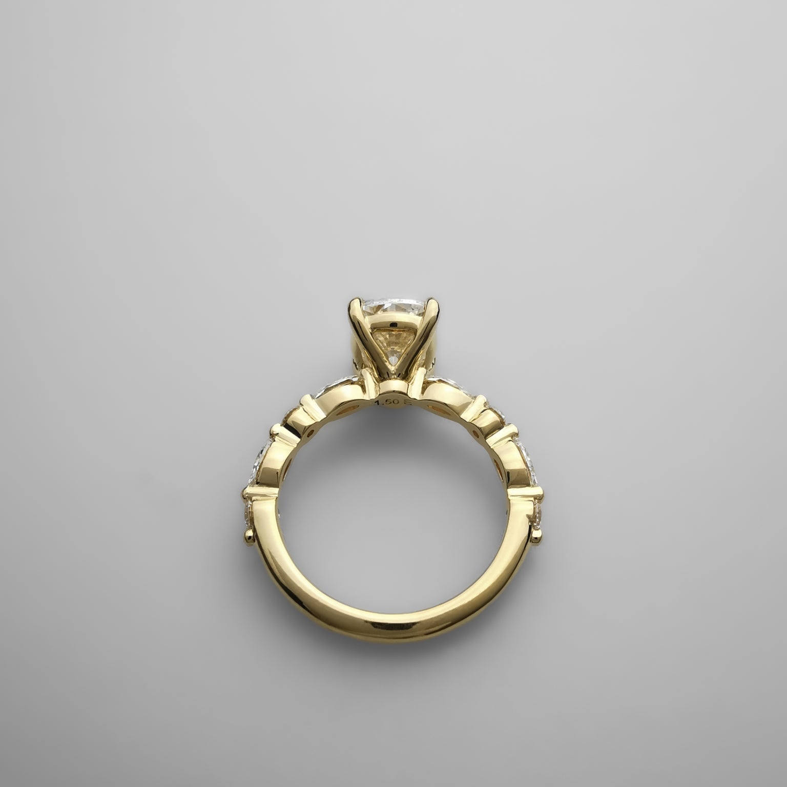 1.5ct cushion cut diamond set in light yellow gold ring