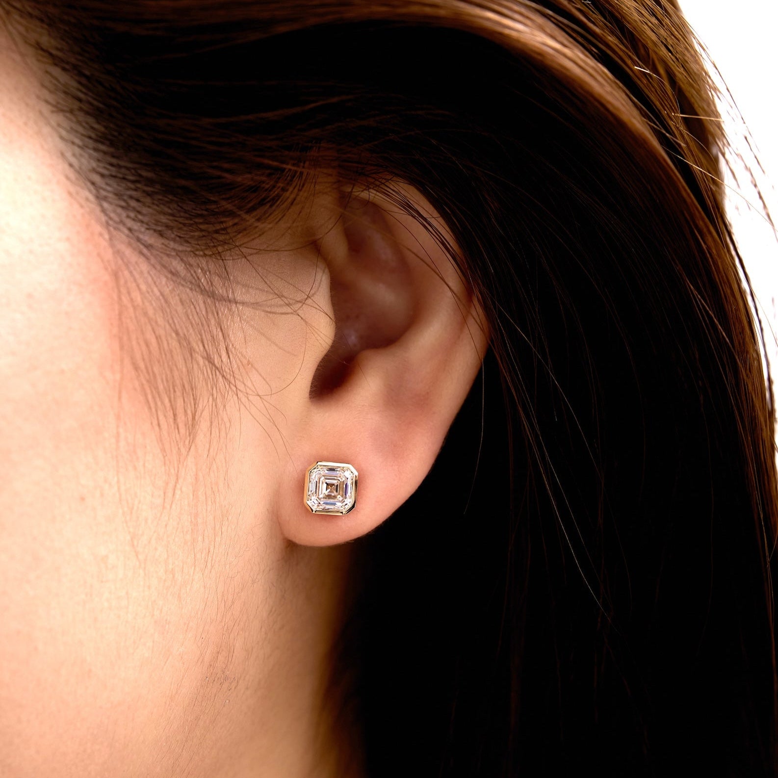 Asscher Diamond Studs in Gold on Ear