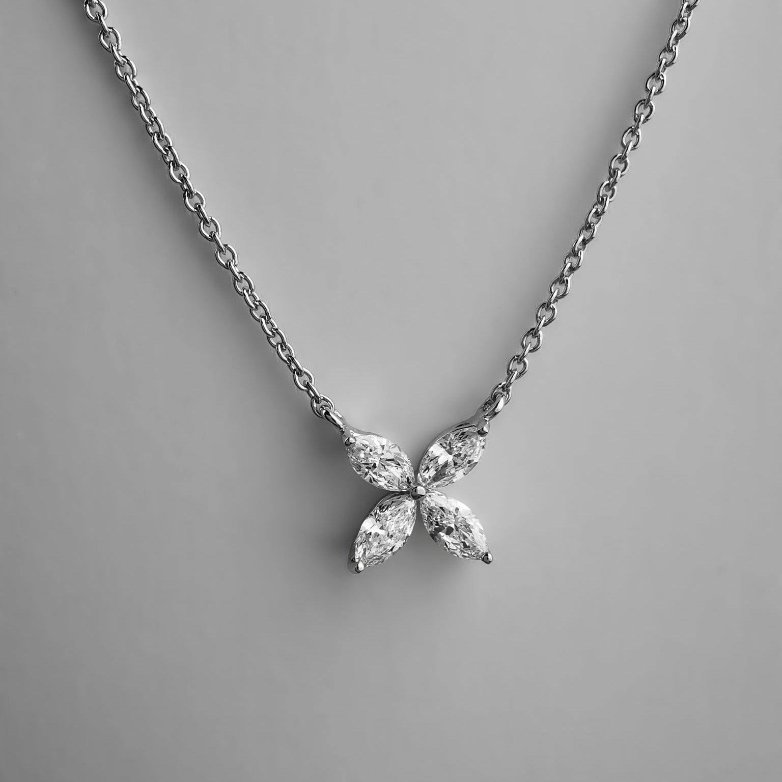 Floral shaped pendant with marquise diamonds