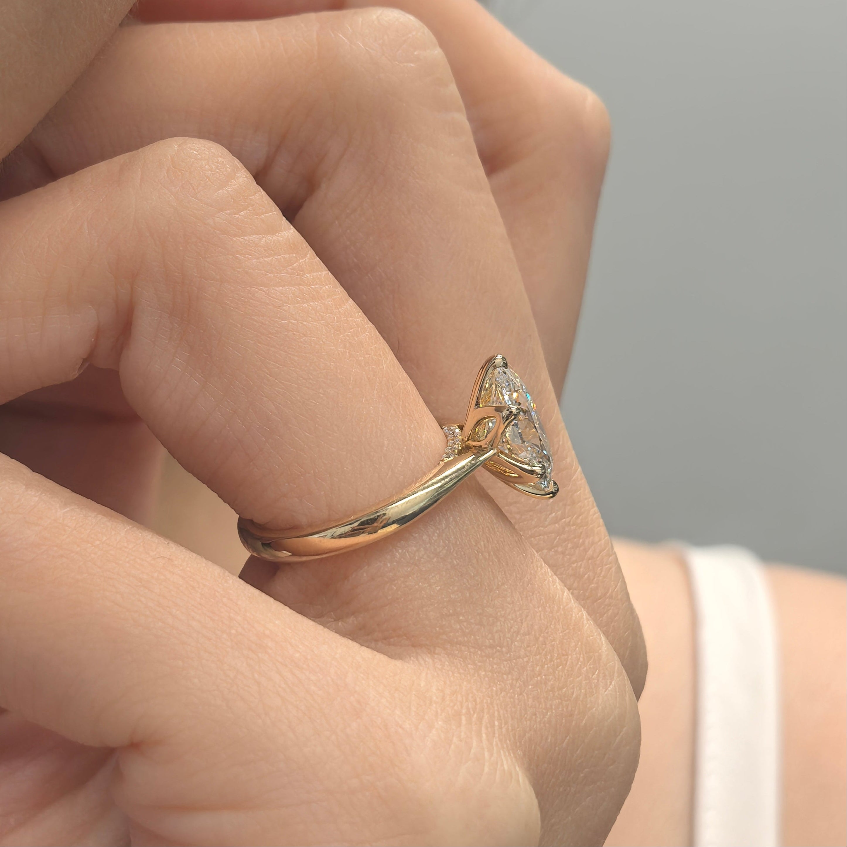 Oval Diamond in Tulip Prong Ring on Hand
