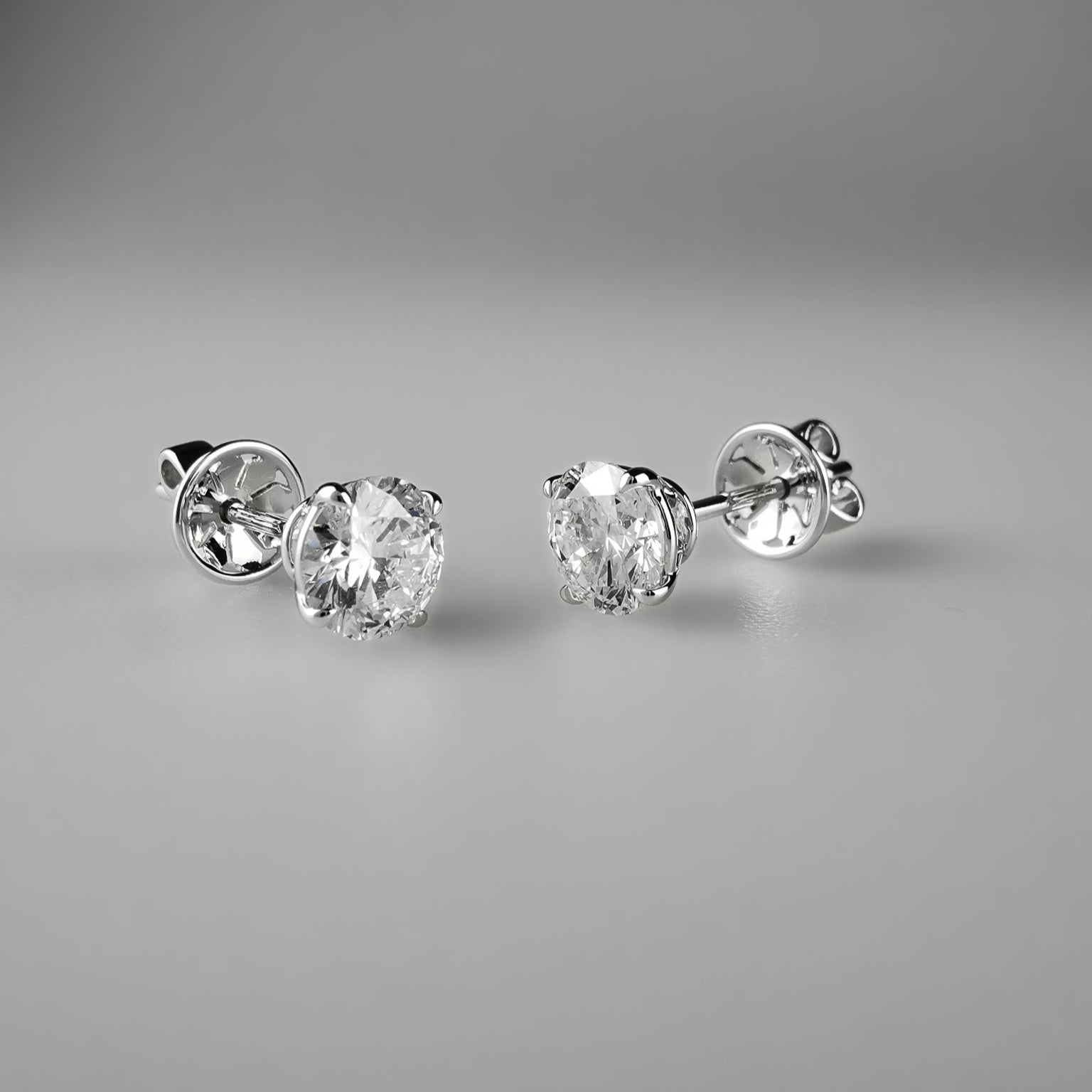 0.5 carat solitaire studs in 18k white gold