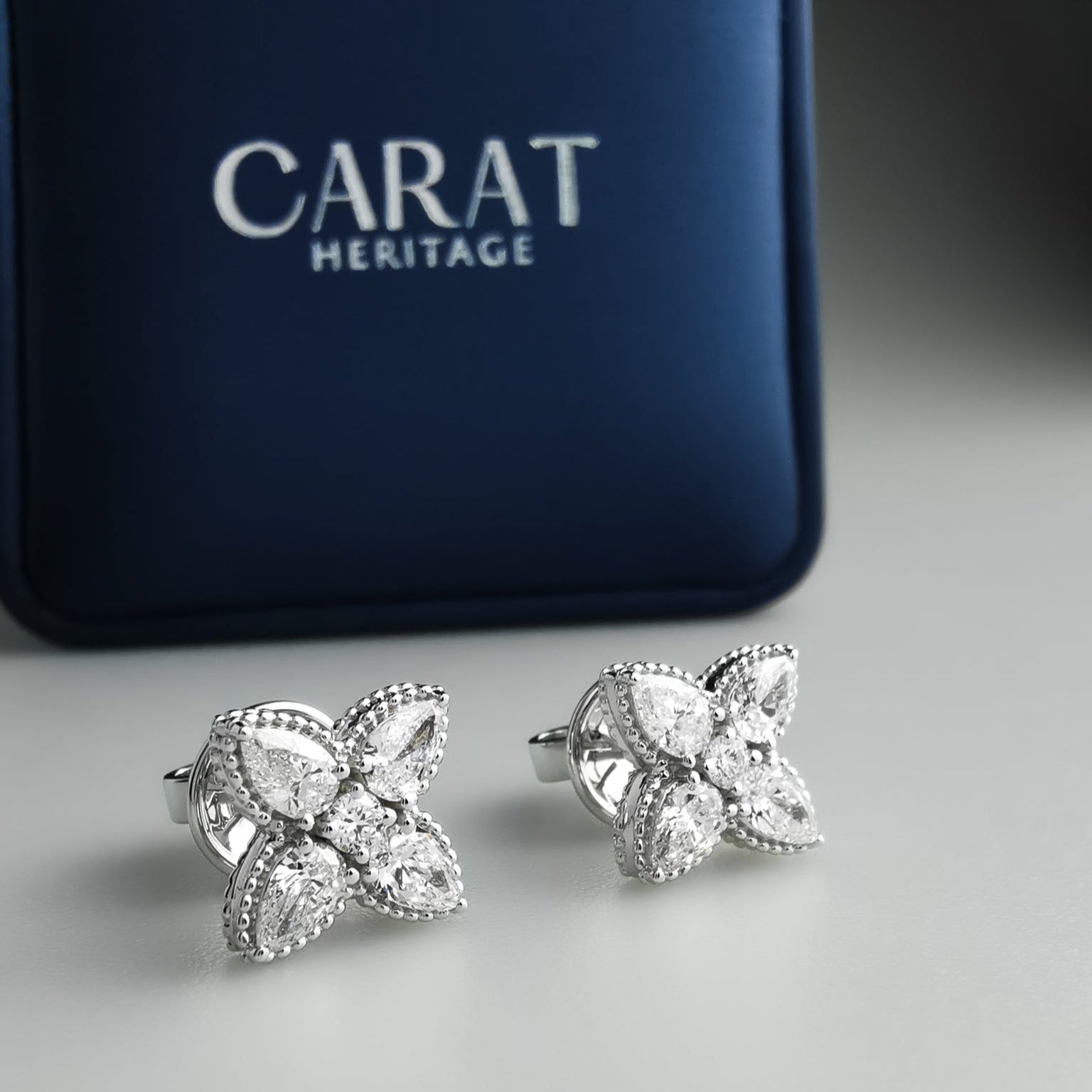 Diamond flower ear studs pear shaped