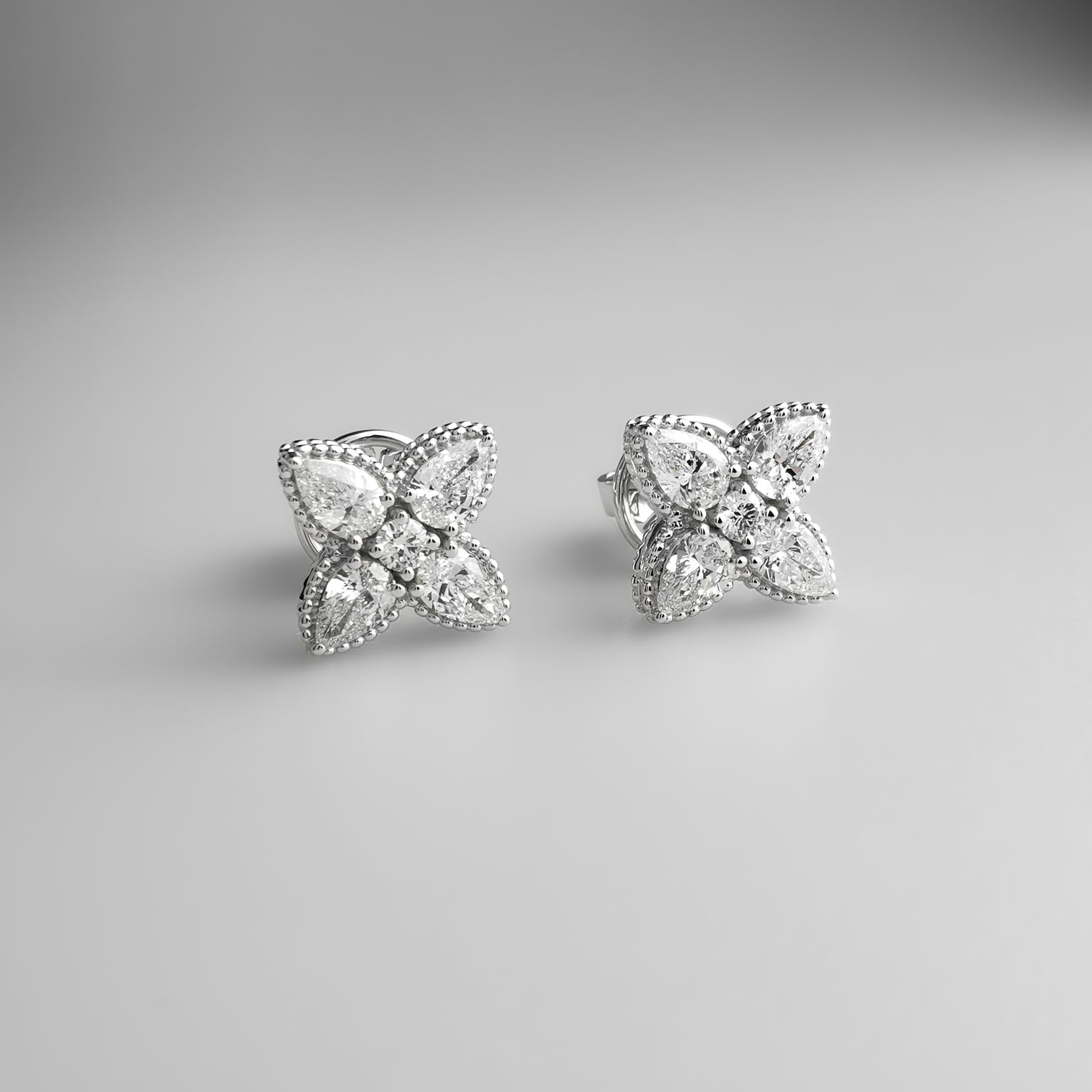 Diamond flower ear studs pear shaped