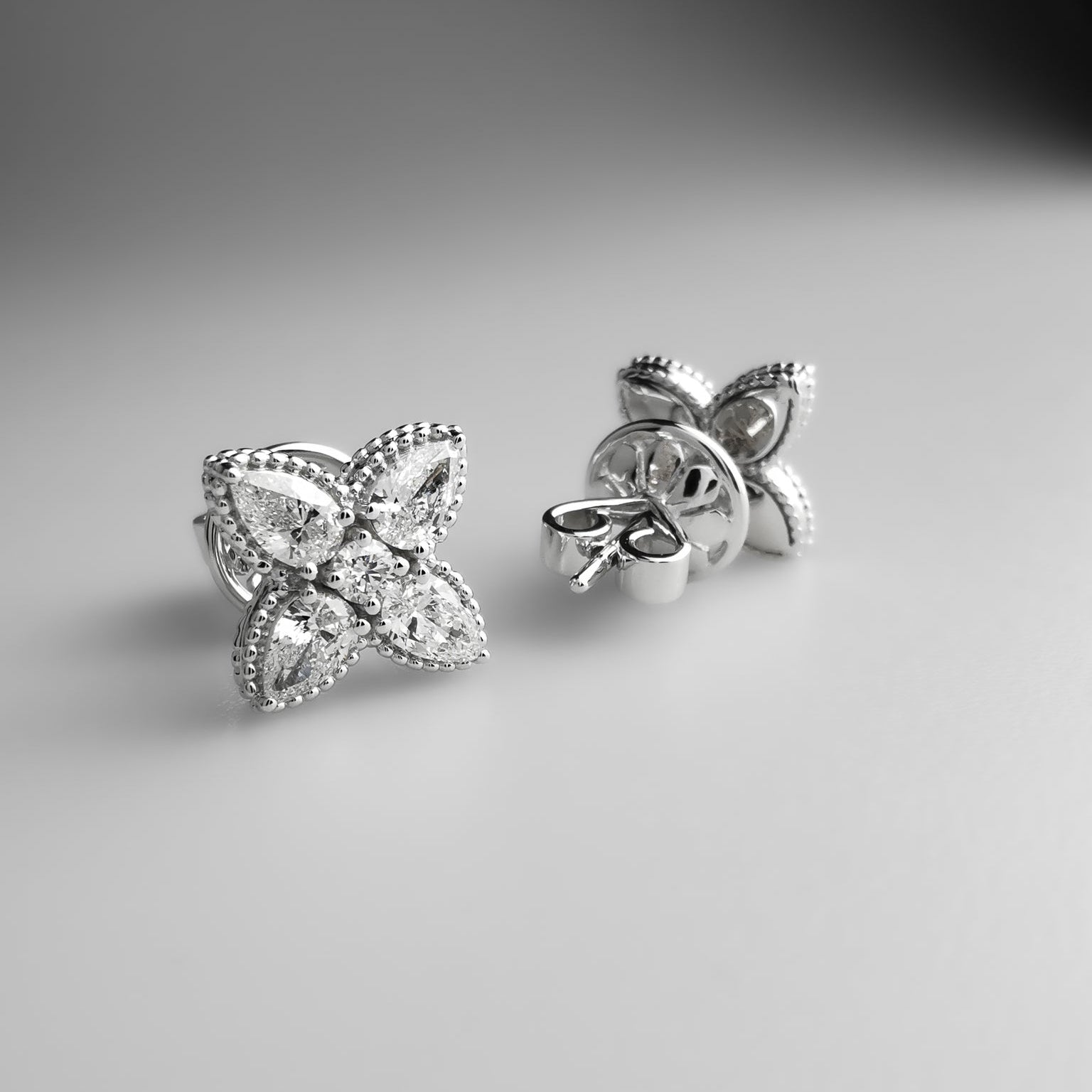 Diamond flower ear studs pear shaped