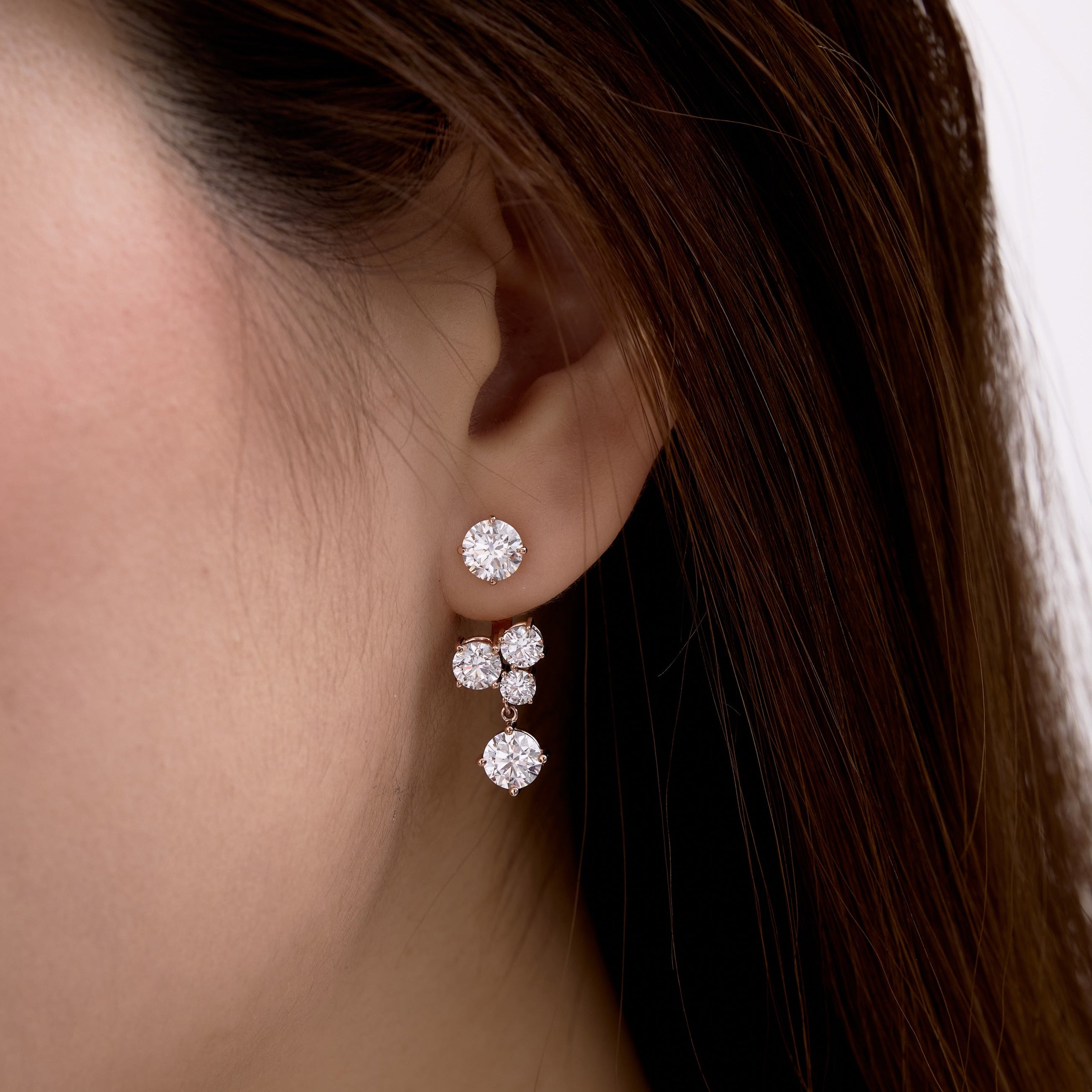 5 round diamonds on drop earrings