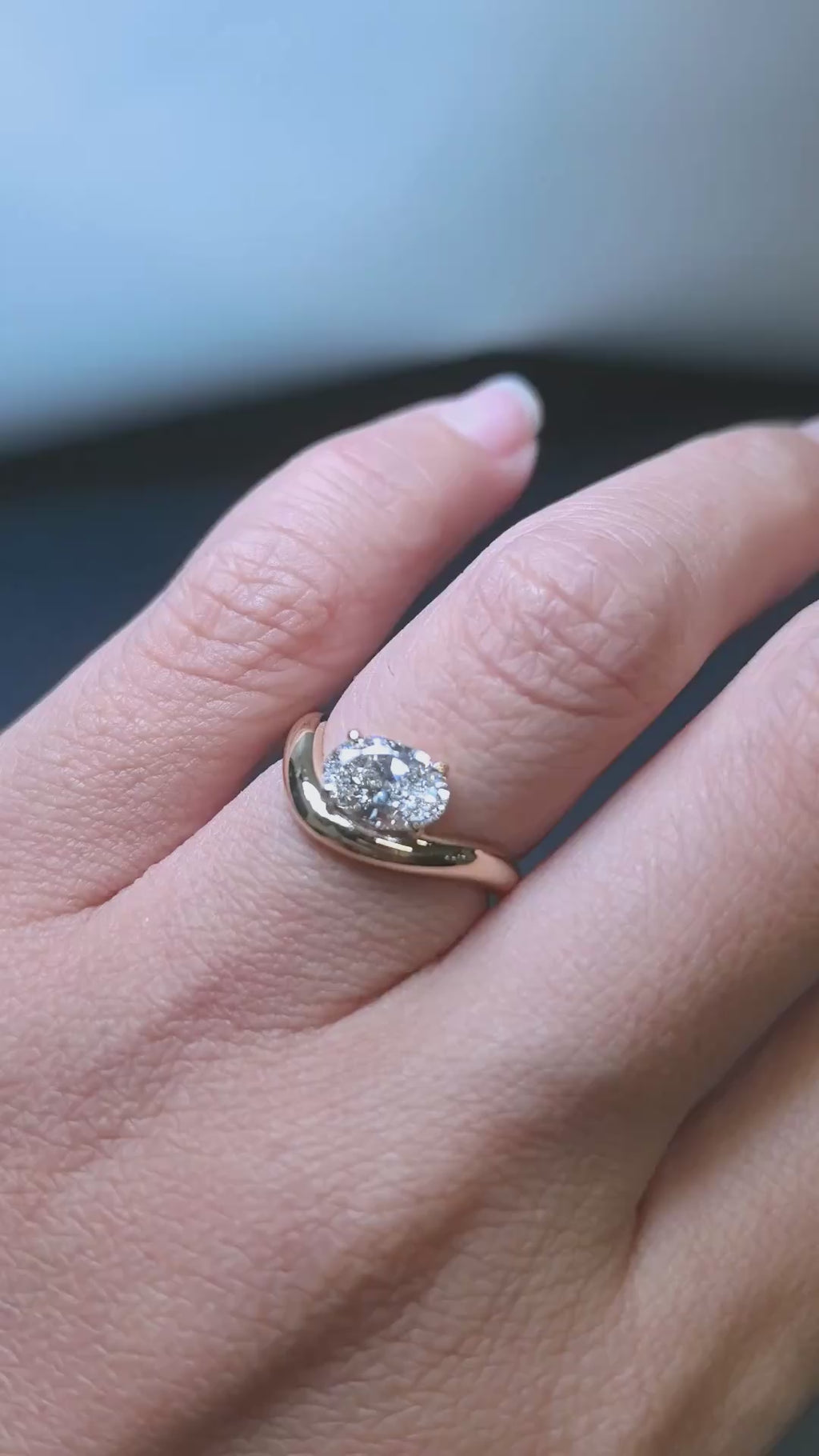 east west oval diamond on gold band