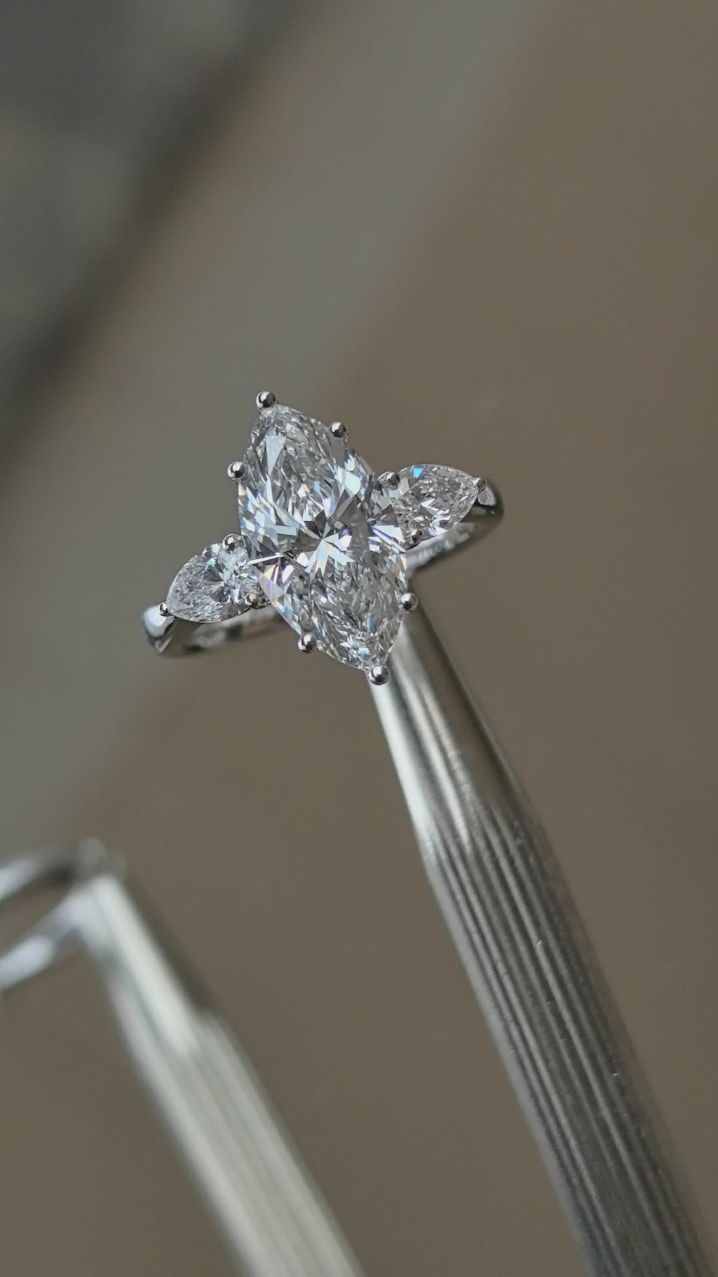 Large marquise diamond ring with side stones