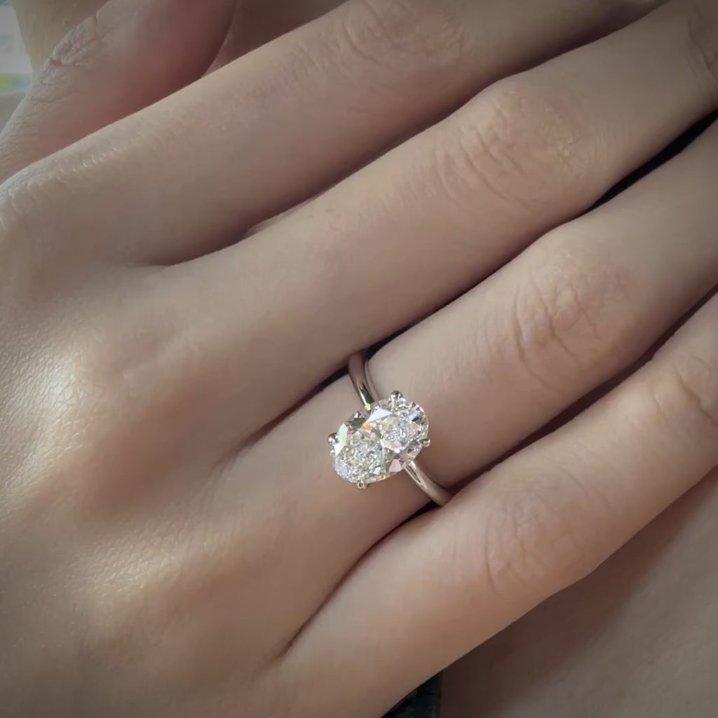 Oval Cut Diamond Ring with Hidden Halo Hands
